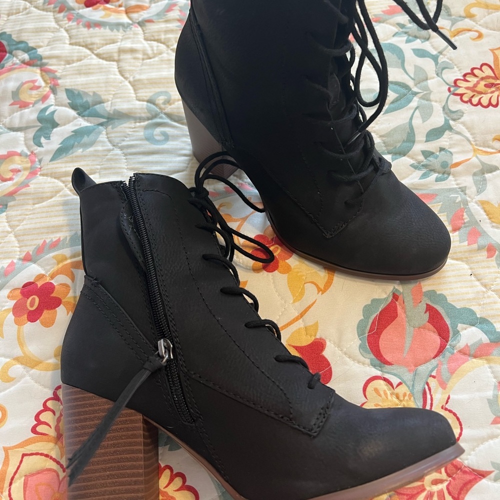 Black lace-up heeled boots